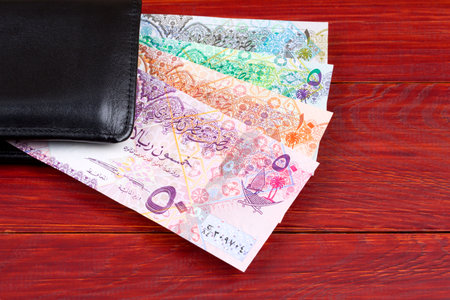Qatari money in the black walletの写真素材