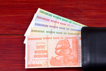 Zimbabwean dollars in the black walletの写真素材