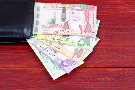 Money from Saudi Arabia in the black walletの写真素材