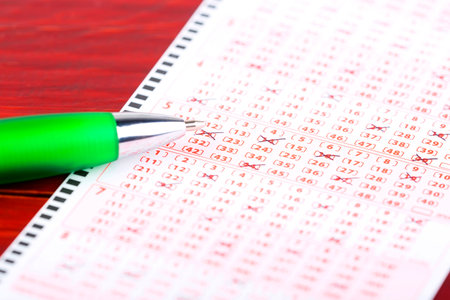 Lottery ticket with a penの写真素材