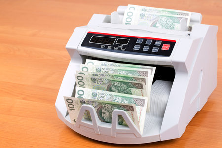 Polish Zloty in a counting machineの写真素材