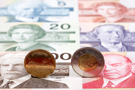 Canadian Dollar coins on the background of banknotesの写真素材