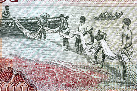Fishermen from old Ghanaian moneyの写真素材