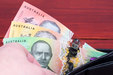 Australian money in the black walletの写真素材
