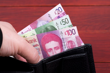 Scottish money - Pounds in a black wallet
