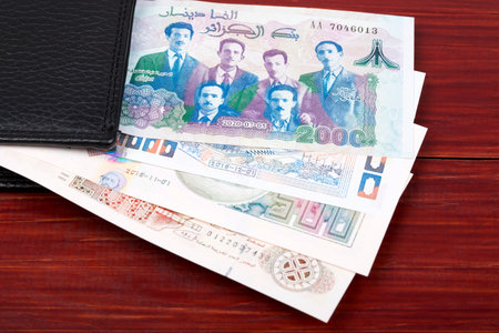 Algerian dinar in the black walletの写真素材