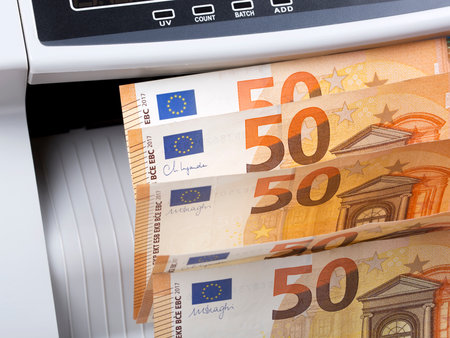 European money - euro in a counting machineの写真素材