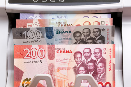 Ghanaian money - cedi in a counting machineの写真素材