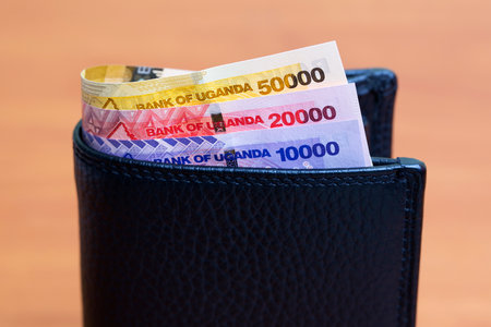 Ugandan money - shilling in the black walletの写真素材