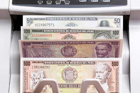 Peruvian money - sol in the counting machineの写真素材