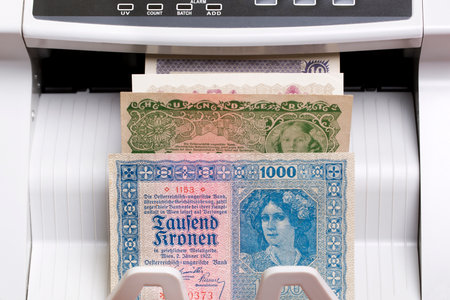 Old Austrian money - crown in the counting machineの写真素材