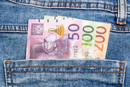 Lesotho money - Loti in the pocket of blue jeansの写真素材