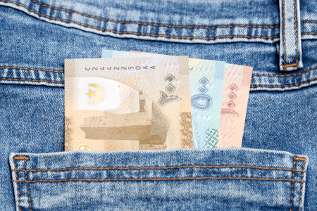 Mauritanian money - ouguiya in the pocket of blue jeansの写真素材