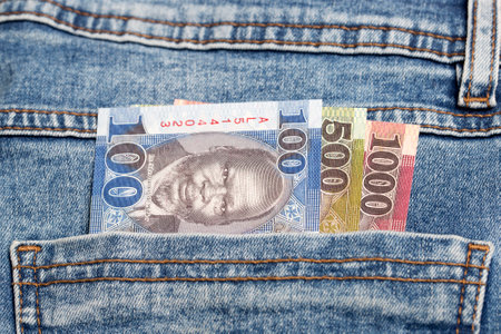 South Sudanese money - Pound in the pocket of blue jeansの写真素材