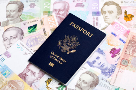 American passport on a Ukrainian money - Hryvniaの写真素材