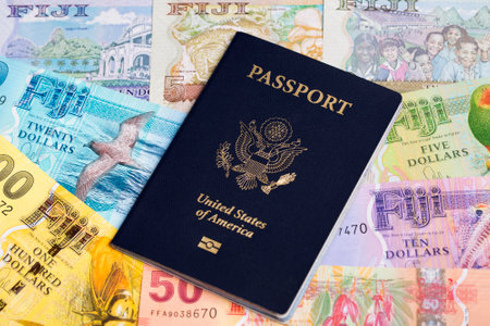 American passport on Fijian money - dollarの写真素材
