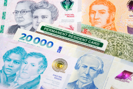 American permanent resident card on Argentine money - Pesoの写真素材