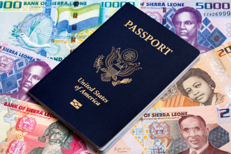 American passport on a Sierra Leonean money - leoneの写真素材