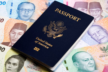 American passport on Indonesian money - rupiahの写真素材