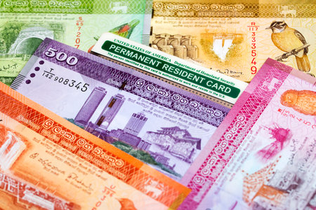 American permanent resident card on Sri Lankan money - Rupeeの写真素材