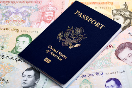 American Passport on Bhutanese money - ngultrumの写真素材