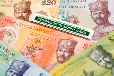 American Permanent Resident Card on Brunei money - dollar