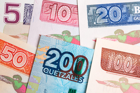 Guatemalan money - quetzal and business backgroundの写真素材