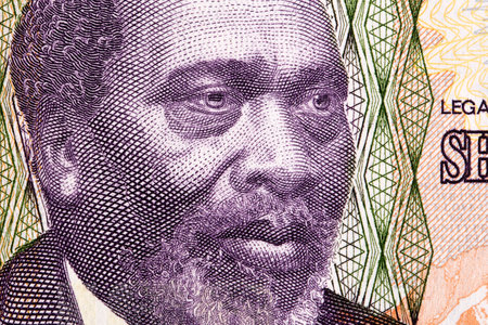 Jomo Kenyatta a closeup portrait from Kenyan money - Schilling