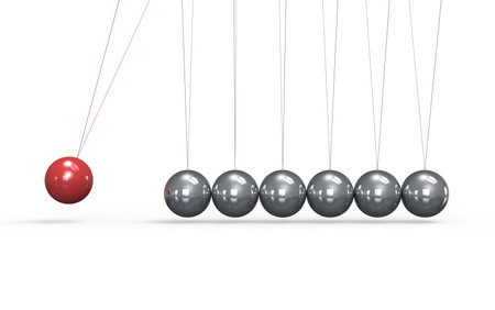Newtons cradle White floor. One red Ball in the Pendulum.の写真素材