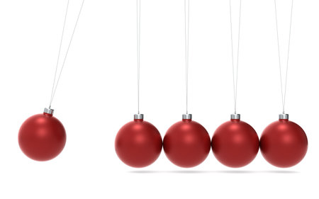 Newtons cradle Christmas Edition. Green and Red balls. Side Viewの写真素材