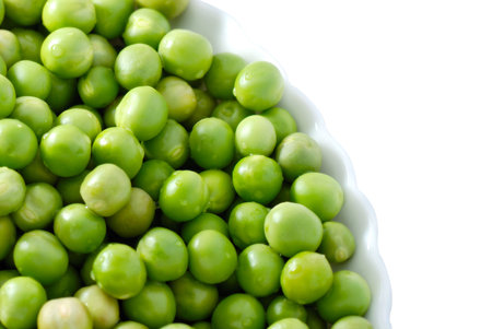 Green peas on the plateの写真素材