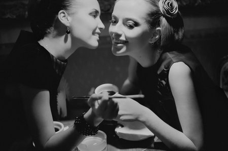 The Portrait of two white girls in a vintage dresses in the style of the sixtiethの写真素材