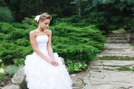 A beautiful bride in the white wedding dress.の写真素材