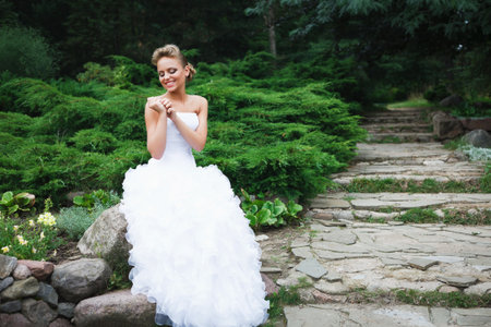 A beautiful bride in the white wedding dress.の写真素材