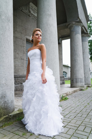 A beautiful bride in the white wedding dress.の写真素材