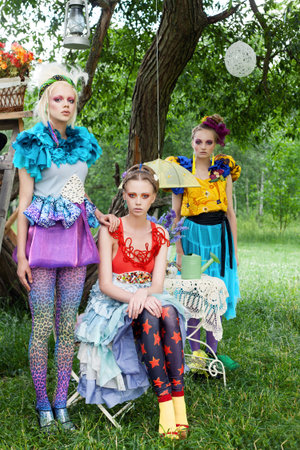 Three beautiful ladies in a garden. Outdoorsの写真素材