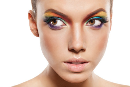 beautiful female face with rainbow makeup. closeup of girl looking awayの写真素材