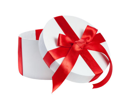 white gift box with red ribbon on white backgroundの写真素材