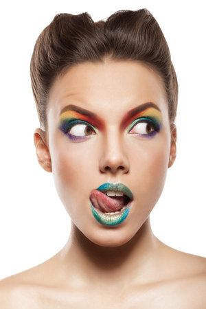 beautiful female face with rainbow makeup. bewildered girlの写真素材