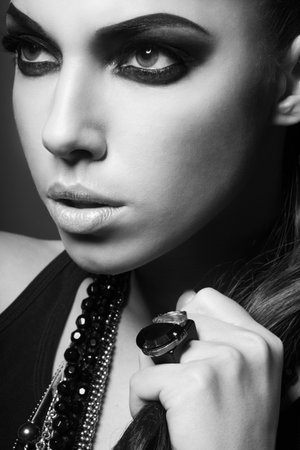 sexy woman with long hair, make-up and smokey eyes in black and whiteの写真素材