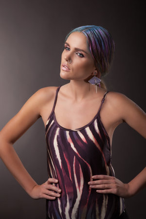woman in a bathing suit with multicoloured hair, indoorの写真素材