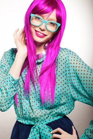 young woman in a bright purple wig, indoorの写真素材