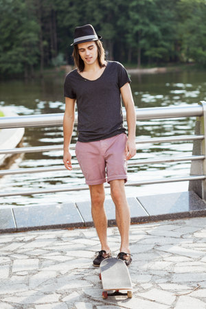 Portrait of a man with a skateboardの写真素材