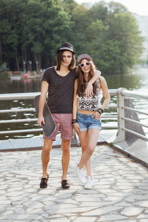 Happy couple on the bank of a riverの写真素材