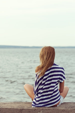 Retro Portrait of girl on the sea background. Outdoors, lifestyleの写真素材