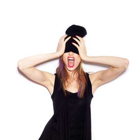 Very upset and emotional woman over white background, not isolatedの写真素材