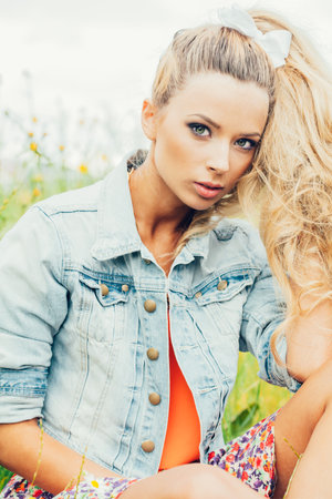 beautiful blonde woman . outdoor lifestyle portrait of a girlの写真素材