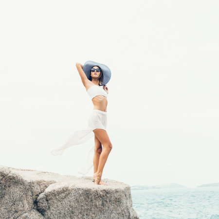 Portrait of Young pretty female model on the sea. Outdoors lifestyle portraitの写真素材