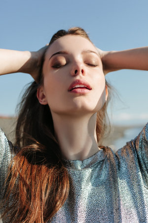 Beautiful girl enjoying the sun and the warmthの写真素材