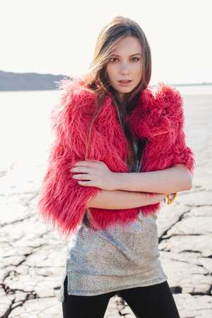 Outdoors lifestyle portrait of the beautiful young female model. Soft sunny colorsの写真素材